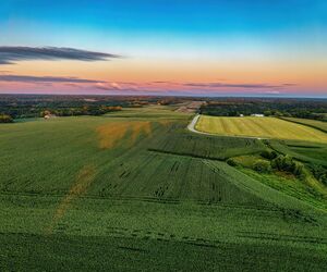 Stunning aerial photo of farmland in Nelson, Wisconsin during sunset with vibrant skies.